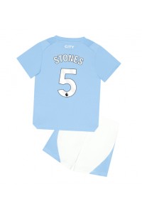 Manchester City John Stones #5 Jalkapallovaatteet Lasten Kotipeliasu 2023-24 Lyhythihainen (+ Lyhyet housut)